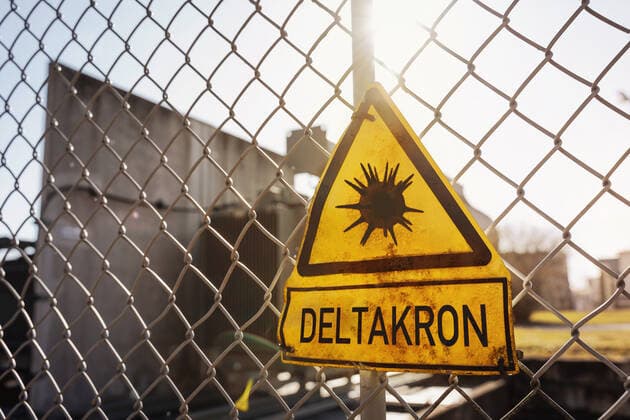 Deltakron neue Covid-19 Coronavirus Mutante Mutation des Sars Cov 2 Virus eine Mischung aus der Delta und Omikron Variante, Warnschild Symbol Delta Kron xFOTOMONTAGEx