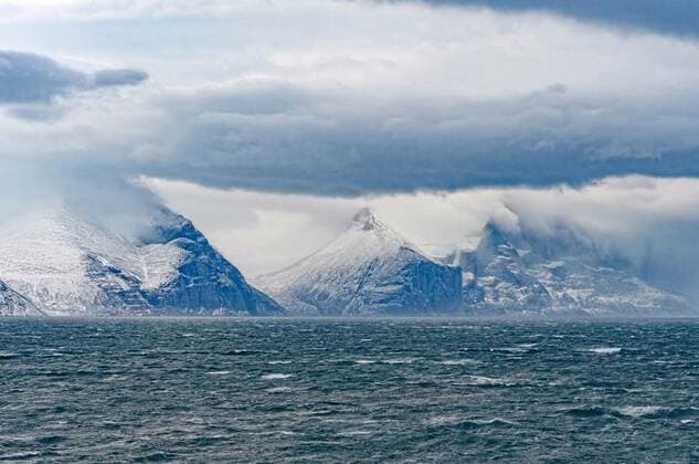 Storm Clouds and Peaks in a High Arctic Fjord, 27.09.2021, Copyright: xwildnerdpixx Panthermedia24692902