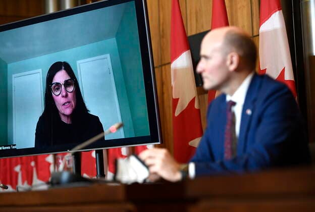 January 17, 2022, Ottawa, ON, CAN: Minister of Health Jean-Yves Duclos listens as Minister of Public Services and Procurement Filomena Tassi speaks via videoconference during a news conference on the COVID-19 pandemic and Health Canada™s approval of the antiviral treatment Paxlovid in Ottawa on Monday, Jan. 17, 2022. Ottawa CAN  - ZUMAc35_ 20220117_zaf_c35_045 Copyright: xJustinxTangx