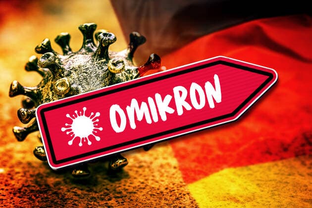 FOTOMONTAGE, Roter Wegweiser mit Aufschrift Omikron, steigende Omikron-Fallzahlen in Deutschland