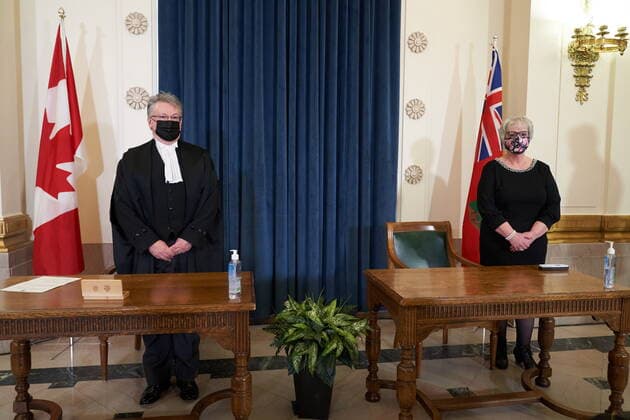 January 18, 2022, Winnipeg, MB, CANADA: Eileen Clarke, right, Minister of Municipal Relations, is sworn as she stands with Richard Chartier, Administrator of the Province at the Manitoba Legislative Building in Winnipeg, Manitoba, Tuesday January 18, 2022. Winnipeg CANADA - ZUMAc35_ 20220118_zaf_c35_050 Copyright: xDavidxLipnowskix