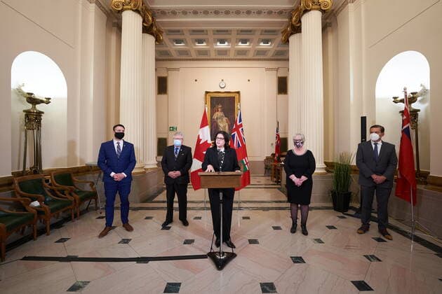 January 18, 2022, Winnipeg, MB, CANADA: Heather Stefanson, Premier of Manitoba, center, speaks to the media at a press conference following a swearing-in ceremony for her cabinet, along side Minister Andrew Smith, left, Minister Scott Johnston, second from left, Minister Eileen Clarke, second from right, and Minister Doyle Piwniuk, right) , at the Manitoba Legislative Building in Winnipeg on Tuesday January 18, 2022. Winnipeg CANADA - ZUMAc35_ 20220118_zaf_c35_064 Copyright: xDavidxLipnowskix