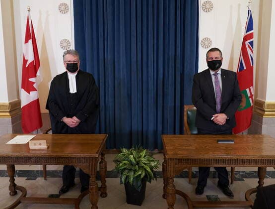 January 18, 2022, Winnipeg, MB, CANADA: Cliff Cullen, Minister of Economic Development, Investment and Trade, and Deputy Premier of Manitoba (right) is sworn in with Richard Chartier, Administrator of the Province at the Manitoba (left) Legislative Building in Winnipeg, Tuesday, January 18, 2022. Winnipeg CANADA - ZUMAc35_ 20220118_zaf_c35_084 Copyright: xDavidxLipnowskix