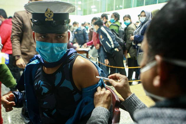 January 19, 2022, Bhaktapur, Bagmati, Nepal: Traffic Police personnel gets booster dose against COVID-19 at a inoculation center at Bir Hospital in Nepali capital Kathmandu. Front line workers working at hospital as well as other places have continued to test positive for the contagion as the Himalayan Nation struggles with the third wave of infection. Bhaktapur Nepal - ZUMAm204 20220119_zip_m204_014 Copyright: xAmitxMachamasix