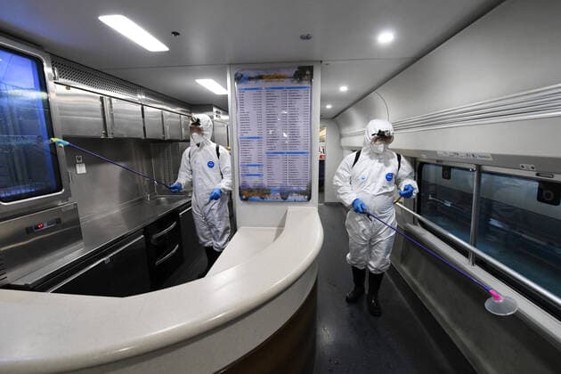 (220120) -- NANNING, Jan. 20, 2022 -- Staff members conduct disinfection work on a train at a maintenance base in Nanning, south China s Guangxi Zhuang Autonomous Region, Jan. 20, 2022. China Railway Nanning Group Co., Ltd. has strictly implemented measures on COVID-19 prevention and control during the Spring Festival travel season which kicked off Monday. ) CHINA-GUANGXI-NANNING-TRAINS-DISINFECTION (CN) LuxBoan 