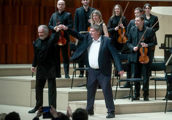MOSCOW, RUSSIA â€” JANUARY 22, 2022: Conductor Valery Gergiev and pianist Boris Berezovsky (L-R front) acknowledge the audience during a concert in which they performed with the Mariinsky Theatre Symphony Orchestra at Zaryadye Concert Hall. The concert was organised by Valery Gergiev Foundation. Sergei Fadeichev TASS  TS11FFE7