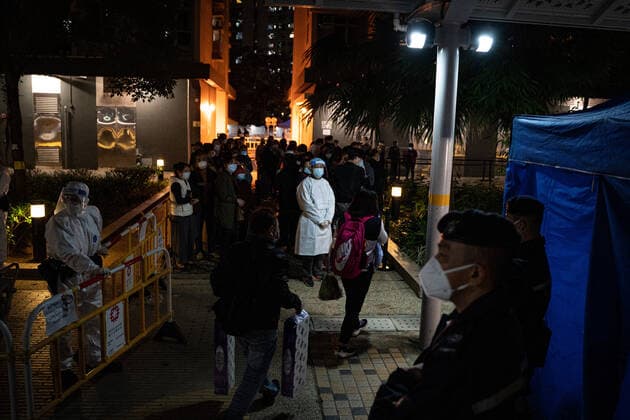 New Outbreak Coronavirus Disease Hong Kong Citizens pass by with daily necessities outside a temporary Covid-19 testing station outside a residential building at the Kwai Chung Estate public housing complex in Hong Kong, Saturday, Jan. 22, 2022. Hong Kong China  Copyright: xLeungxManxHeix originalFilename: manhei-notitle220122_npXv3.jpg