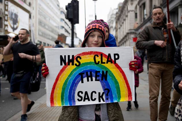 January 22, 2022, London, United Kingdom: A demonstrator holds a placard during the demonstration..Thousands of people marched on the street in Central London to protest against mandatory COVID vaccination to all NHS staff by 1st April 2022. The national call of action was organised by NHS100K who estimated there are over 100,000 of health and social care staff would lose their jobs over the mandates. They called for an open dialogue with Sajid Javid, the current Secretary of State for Health and Social Care of the UK government, regarding the issues on making COVID vaccination mandatory for NHS staff. London United Kingdom - ZUMAs197 20220122_zaa_s197_093 Copyright: xHestherxNgx