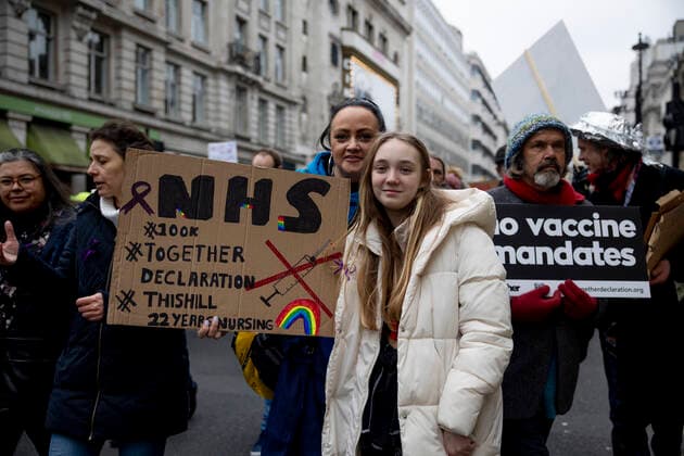 January 22, 2022, London, United Kingdom: Demonstrators are seen holding placards during the demonstration..Thousands of people marched on the street in Central London to protest against mandatory COVID vaccination to all NHS staff by 1st April 2022. The national call of action was organised by NHS100K who estimated there are over 100,000 of health and social care staff would lose their jobs over the mandates. They called for an open dialogue with Sajid Javid, the current Secretary of State for Health and Social Care of the UK government, regarding the issues on making COVID vaccination mandatory for NHS staff. London United Kingdom - ZUMAs197 20220122_zaa_s197_096 Copyright: xHestherxNgx