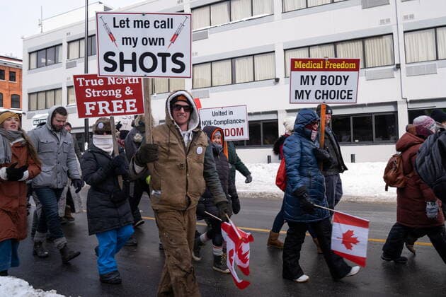 January 22, 2022, Ottawa, ON, CANADA: Demonstrators march in protest against public health measures taken by authorities to curb the spread of COVID-19, in Ottawa, Saturday, Jan. 22, 2022. Ottawa CANADA  - ZUMAc35_ 20220122_zaf_c35_025 Copyright: xMichaelxChisholmx