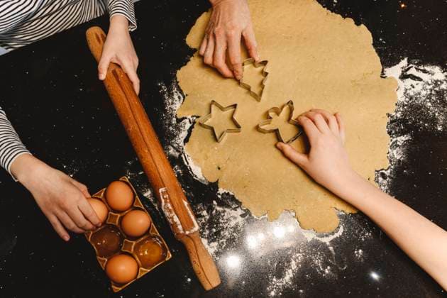Family preparing cookies with cookie cutter on kitchen island model released property released, EYAF01860