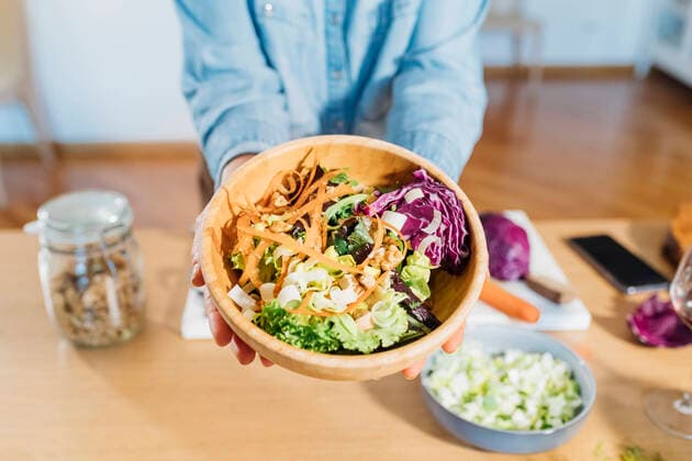 Woman holding salad bowl at home model released property released, MEUF05123
