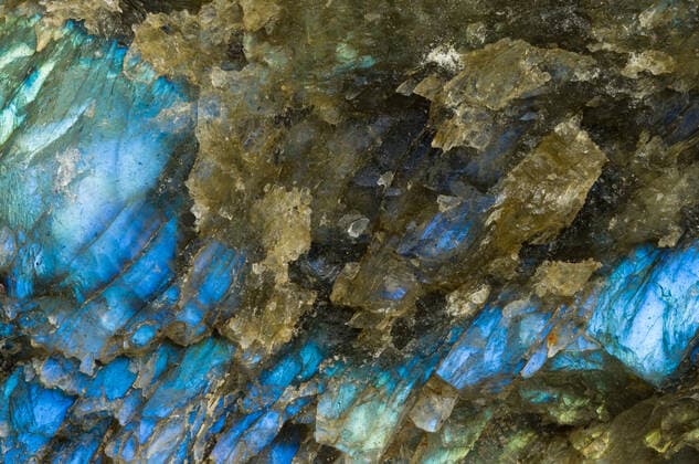 Close up of the rough cut exterior surface of a piece of labradorite MarkWindom_MinI_5.jpg Copyright: xMarkxWindomx Model Released
