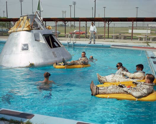 January 27, 2022, Houston, Texas, USA: In this June 1966 file photo, the Apollo 1 crew practices water egress procedures with a full scale boilerplate model of the spacecraft. In the water at right are astronauts Ed White and Roger Chaffee (foreground). In raft near the spacecraft is astronaut Gus Grissom. swimmers are in the water to assist in the practice session that took place at Ellington AFB, near the then-Manned Spacecraft Center. On January 27, 1967, tragedy struck on the launch pad at Cape Kennedy during a preflight test for Apollo 204. The mission was to be the first crewed flight of Apollo. Astronauts Virgil Grissom, Edward White, and Roger Chaffee lost their lives when a fire swept through the command module on Jan. 27, 1967, - ZUMAz03_ 20220127_slz_z03_443 Copyright: xNASAx