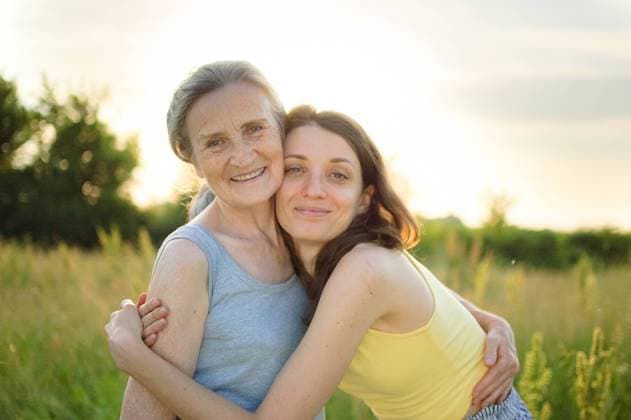 Senior mother with gray hair with her adult daughter looking at the camera in the garden and hugging each other during sunny day outdoors, mothers day Senior mother with gray hair with her adult daughter looking at the camera in the garden and hugging each other during sunny day outdoors, mothers day concept Copyright: xx 39865478