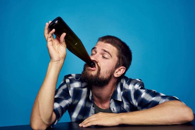 a man in a plaid shirt drinking beer alcohol emotion isolated background a man in a plaid shirt drinking beer alcohol emotion isolated background. High quality photo Copyright: xx 39935552