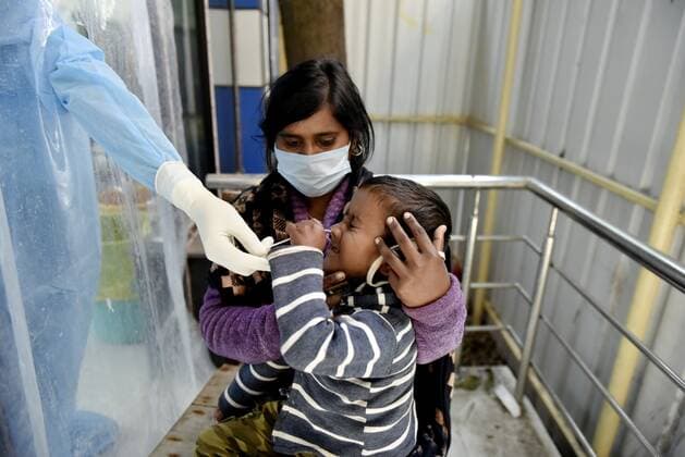 Coronavirus Emergency In India A child reacts as a health worker puts a cotton swab into his nose during rapid Antigen test amid coronavirus emergency in Kolkata, India, 28 January, 2022. Kolkata India  Copyright: xIndranilxAdityax originalFilename: aditya-notitle220128_npwe8.jpg