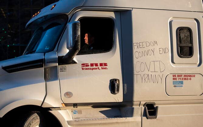 January 28, 2022, Ottawa, ON, CAN: A trucker participating in a cross-country convoy protesting measures taken by authorities to curb the spread of COVID-19 parks on Wellington Street in front of Parliament Hill in Ottawa, on Friday, Jan. 28, 2022. Ottawa CAN  - ZUMAc35_ 20220128_zaf_c35_073 Copyright: xJustinxTangx