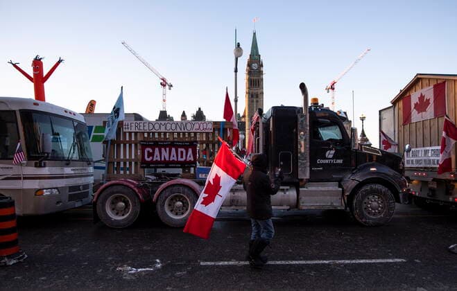 January 28, 2022, Ottawa, ON, CAN: Trucks participating in a cross-country convoy protesting measures taken by authorities to curb the spread of COVID-19 are parked on Wellington Street in front of Parliament Hill in Ottawa, on Friday, Jan. 28, 2022. Ottawa CAN  - ZUMAc35_ 20220128_zaf_c35_076 Copyright: xJustinxTangx