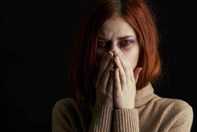 red-haired woman with bruises under her eyes scared crying depression red-haired woman with bruises under her eyes scared crying depression. High quality photo Copyright: xx 42883524