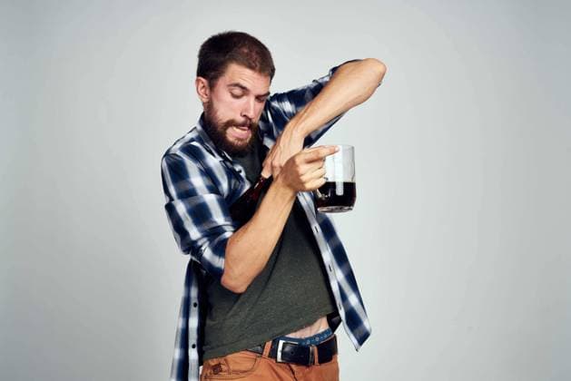 a man in a plaid shirt alcoholism problems emotions depression light background a man in a plaid shirt alcoholism problems emotions depression light background. High quality photo Copyright: xx 43151380