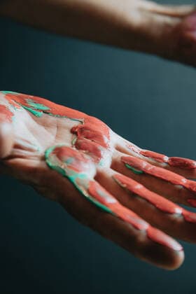 Fun leisure. Creative female artist showing hands dirty with different colors paint.Dark background. Artistic creative concepts, beauty image Copyright: xAvelinoxCalvarxMartinezx 43273826
