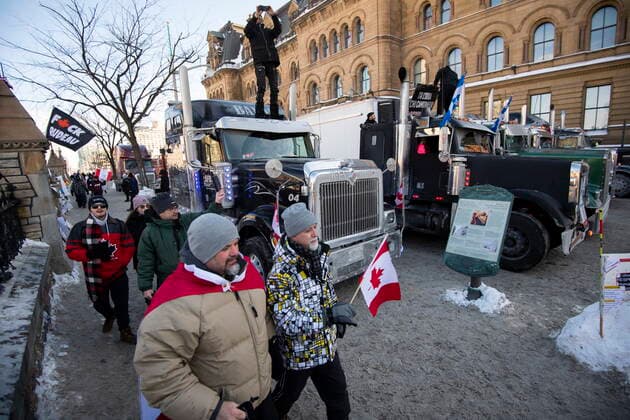 January 30, 2022, Ottawa, ON, CAN: Trucks are parked along the sidewalk and on Wellington Street outside the Office of the Prime Minister and Privy Council during a rally against COVID-19 restrictions on Parliament Hill, which began as a cross-country convoy protesting a federal vaccine mandate for truckers, in Ottawa, on Sunday, Jan. 30, 2022. Ottawa CAN  - ZUMAc35_ 20220130_zaf_c35_007 Copyright: xJustinxTangx