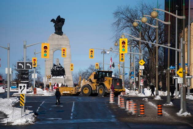 January 30, 2022, Ottawa, ON, CAN: A snowplow is parked across Elgin Street as police restrict more city streets on the second official day of a rally against COVID-19 restrictions on Parliament Hill, which began as a cross-country convoy protesting a federal vaccine mandate for truckers, in Ottawa, on Sunday, Jan. 30, 2022. Ottawa CAN  - ZUMAc35_ 20220130_zaf_c35_017 Copyright: xJustinxTangx