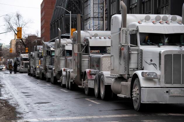 January 30, 2022, Ottawa, ON, CAN: Trucks are parked on Metcalfe Street as a rally against COVID-19 restrictions, which began as a cross-country convoy protesting a federal vaccine mandate for truckers, continues in Ottawa, on Sunday, Jan. 30, 2022. Ottawa CAN  - ZUMAc35_ 20220130_zaf_c35_096 Copyright: xJustinxTangx