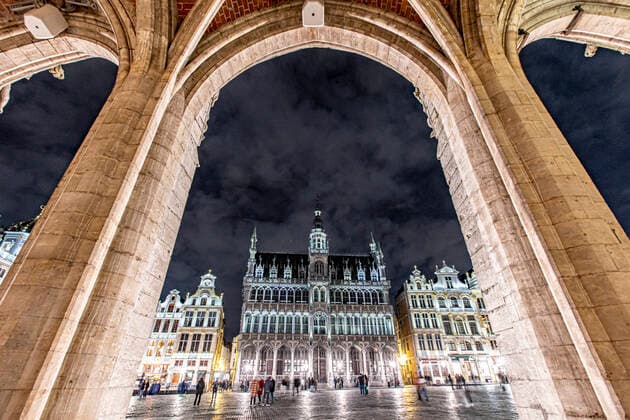Illuminated Grand Place Square In Brussels Panoramic night view with the illuminated historic picturesque buildings of Grand Place square in the Belgian capital. The Grand Place - Grand Square or Grote Markt is a central square in Brussels. It is surrounded by opulent Baroque guildhalls of the former Guilds of Brussels, two larger edifices, the city s Flamboyant Town Hall, and the neo-Gothic King s House or Bread House building containing the Brussels City Museum. The Grand Place began construction in the 11th century and was largely complete by the 17th. Grand Place is the most important tourist destination, an attraction with cafes, restaurants and museums and most memorable landmark in Brussels, one of the most visited squares in Europe.  Copyright: xNicolasxEconomoux originalFilename: economou-illumina220130_npOhq.jpg