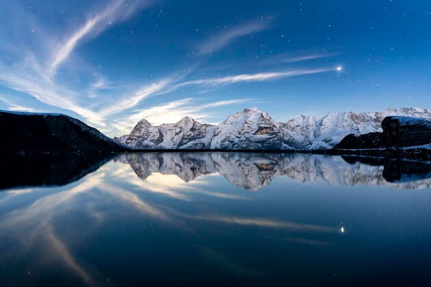 Eiger, Monch and Jungfrau mountains mirrored in Engital lake under the stars, Murren Birg, Bern Canton, Swiss Alps, Switzerland, Europe Copyright: RobertoxMoiola 1179-5543