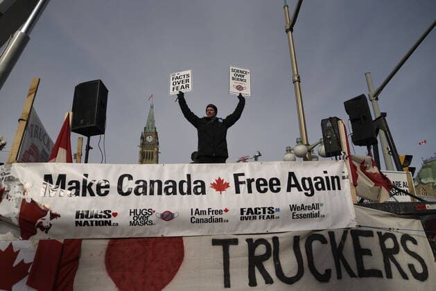 4th Day Of Trucker s Protest At Parliament Hill Protesters waiving signs in front of the Parliament building during the 4th Day of Trucker s protest against the mandatory vaccine policy imposed on the Canadian truckers returning from USA to avoid a two week quarantine at Parliament Hill in Ottawa-Canada Ottawa Canada  Copyright: xArindamxShivaanix originalFilename: shivaanibahuguna-notitle220201_np0xm.jpg