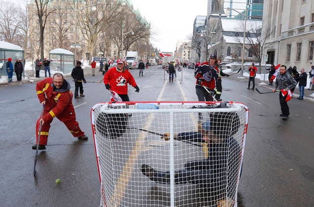 February 1, 2022, Ottawa, ON, CANADA: Truckers and their supporters play street hockey on Wellington Street as a rally against COVID-19 restrictions, which began as a cross-country convoy protesting a federal vaccine mandate for truckers, continues in Ottawa, on Tuesday, February 1, 2022. As organizers behind the demonstration that has seized the nation s capital say they are preparing to stick around even longer by distributing fuel and supplies to the trucks clogging up Ottawa streets, politicians at all levels of government are asking them to roll out. Ottawa CANADA  - ZUMAc35_ 20220201_zaf_c35_081 Copyright: xPatrickxDoylex