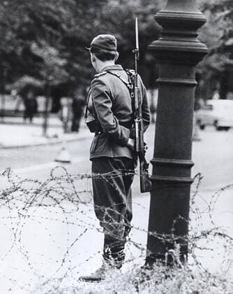 August 1961 - Standing Like A Forlorn Symbol of Repression, This Teen-Aged East German Soldier Stand Guard By The Closed Border 1062_05_M_-12908-