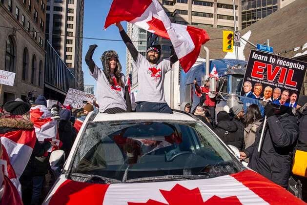 February 5, 2022, Toronto, Ontario, Canada: Protesters gather on the streets on Toronto in opposition of COVID-19 measures and vaccine mandates imposed by the Justin Trudeau government. Organized by the Ã¢â‚¬oeFreedom ConvoyÃ¢â‚¬Â, the demonstration began with a cross-country trek opposing the federal governmentÃ¢â‚¬â ¢s vaccine mandate for cross-border truckers. Toronto Canada - ZUMAc232 20220205_zip_c232_012 Copyright: xGilesxCampbellx