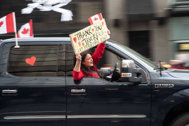 February 5, 2022, Vancouver, British Columbia, Canada: Protesters against COVID-19 safety mandates take to the streets of downtown Vancouver Feb. 5. A convoy of hundreds of vehicles travelled from several nearby municipalities to show their support for the so-called Freedom Convoy of truckers, who brought their protest of mandated vaccines for travel to and from the United States to the nationÃ¢â‚¬â ¢s capital, Ottawa, Ontario, bringing parts of the city to a stand still for the past five days. Vancouver Canada - ZUMAb217 20220205_zip_b217_008 Copyright: xQuinnxBenderx