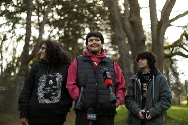 February 11, 2022, VICTORIA, BC, CANADA: Bear Henry is joined by friends Nakita Sekhon, left, and Shae Perkins during a press conference at Beacon Hill Park in Victoria, Friday, Feb. 11, 2022. Henry went missing for 74 days while participating in the old-growth logging protests in Fairy Creek in the Cowichan Valley area near Port Renfrew. Henry was found by loggers in the area before returning home safely. VICTORIA CANADA  - ZUMAc35_ 20220211_zaf_c35_190 Copyright: xChadxHipolitox