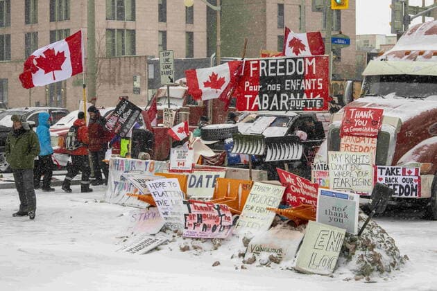 February 12, 2022, Ottawa, on, Canada: Anti-mandate protesters demonstrate in the snow during a demonstration against COVID-19 restrictions on Parliament Hill, in Ottawa, Saturday, Feb. 12, 2022. Ottawa Canada  - ZUMAc35_ 20220212_zaf_c35_138 Copyright: xFrankxGunnx