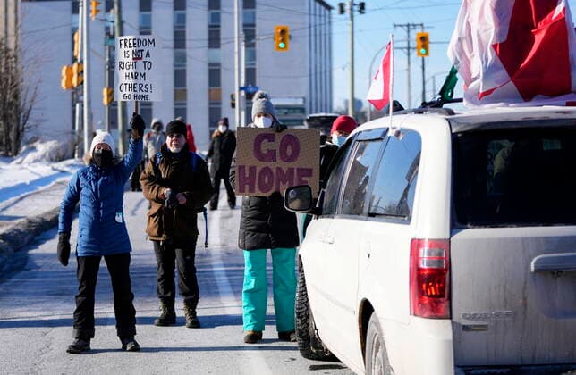 February 13, 2022, Ottawa, ON, CAN: Residents participate in a counter protest to stop vehicles from driving in a convoy en route to Parliament Hill, on the 17th day of a protest against COVID-19 measures that has grown into a broader anti-government protest, in Ottawa, Sunday, Feb. 13, 2022. Ottawa CAN  - ZUMAc35_ 20220213_zaf_c35_070 Copyright: xJustinxTangx