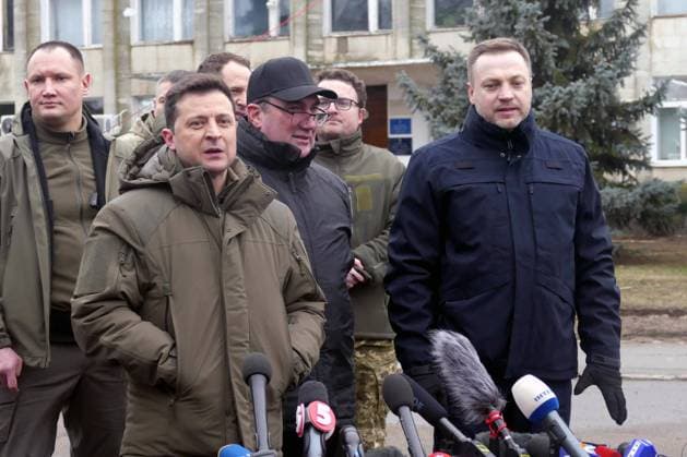 KHERSON REGION, UKRAINE - FEBRUARY 12, 2022 - President of Ukraine Volodymyr Zelenskyy (L) speaks to the press in the presence of secretary of the National Security and Defence Council (NSDC) of Ukraine Oleksiy Danilov (C) and Minister of Internal Affairs of Ukraine Denys Monastyrskyy (R) during a briefing held on the sidelines of special tactical drills organised to demonstrate the actions of Interior Ministry units and practise measures to release of administrative buildings, Kherson Region, southern Ukraine. Briefing of Volodymyr Zelenskyy in Kherson Region  Copyright: xYuliixZozuliax