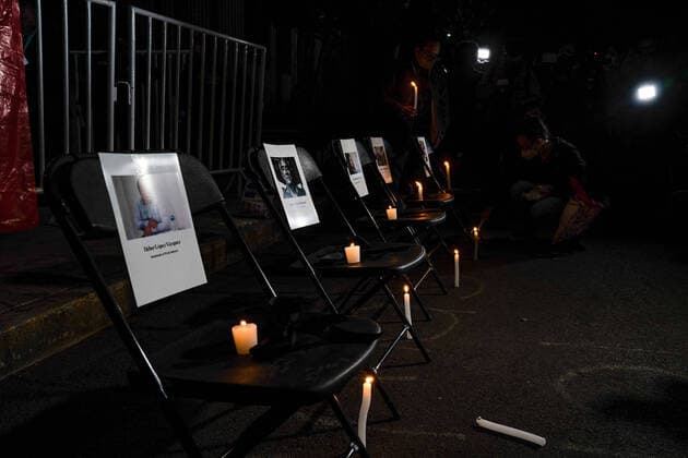 February 14, 2022, Mexico, Mexico: Lit candles are placed next to the pictures of the five journalists who have been murdered in Mexico in 2022..Dozens of journalists came together to protest outside the offices of the Ministry of Interior in Mexico City. It was part of a simultaneous national protest that took place across Mexico following the murder of the fifth journalist in 2022. Mexico Mexico - ZUMAs197 20220214_zaa_s197_397 Copyright: xLexiexHarrison-Crippsx
