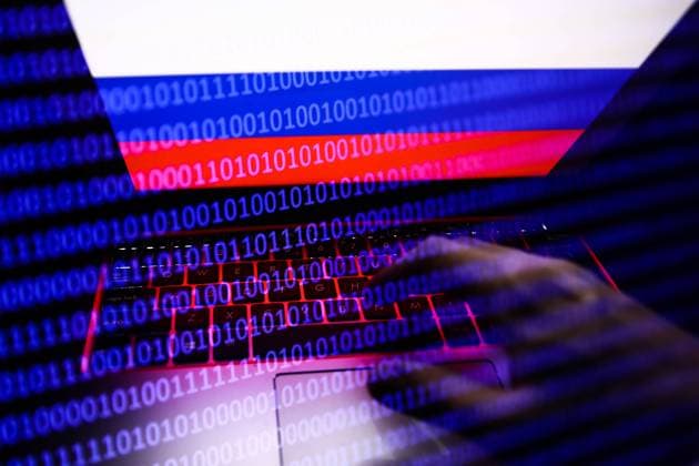 Russia, Ukraine And Internet Hacking Photo Illustrtions Russian flag displayed on a laptop screen and binary code code displayed on a screen are seen in this multiple exposure illustration photo taken in Krakow, Poland on February 16, 2022. (Photo illustration by Jakub Porzycki NurPhoto) Krakow Poland  Copyright: xJakubxPorzyckix originalFilename: porzycki-russiauk220216_np4U2.jpg