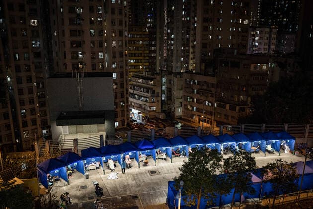 February 16, 2022, Hong Kong, China: Temporary tents are set for the covid-19 patients to rest outside Caritas Medical Centre in Sham Shui Po..Hong Kong is struggling to contain the outbreak of Covid-19, with most of hospitals running over their capacity. Patients on hospital beds lined up outside A&E departments of the Caritas Medical Centre waiting to get into the hospital. Hong Kong China - ZUMAs197 20220216_zaa_s197_058 Copyright: xDominicxChiux