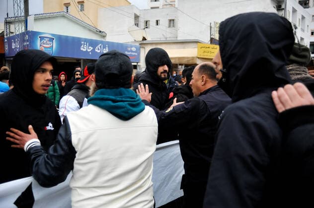 February 17, 2022, Tunis, Tunisia: Grand Tunis, Tunisia. 17 February 2022. Supporters of Football Club Africain stage a protest for the death of football fan Omar Abidi, in front of the Court of First Instance in the Tunisian city of Ben Arous. Omar Abidi, 19, drowned in a stream near the Rades Stadium in 2018, following a match between Club Africain and the Olympique Medenine teams. Abidi s family has filed a complaint against the police, with many football fans also blaming the police for he tragic death of the 19-year-old Tunis Tunisia - ZUMAd99_ 20220217_zap_d99_025 Copyright: xHasanxMradx