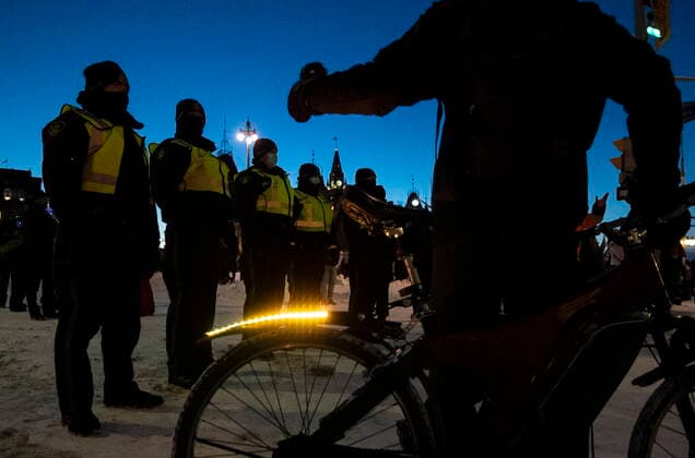 February 18, 2022, Ottawa, ON, CAN: Police stand along Rideau Street as they aim to end an ongoing protest against COVID-19 measures that has grown into a broader anti-government protest, on its 22nd day, in Ottawa, on Friday, Feb. 18, 2022. Ottawa CAN  - ZUMAc35_ 20220218_zaf_c35_228 Copyright: xJustinxTangx