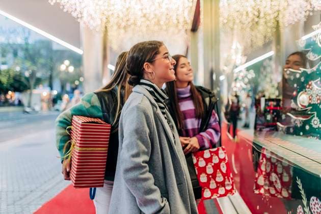 Young women window shopping at Christmas model released, JRVF02703