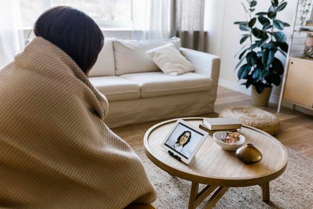 Woman discussing with doctor through tablet PC at home model released property released, XLGF02622