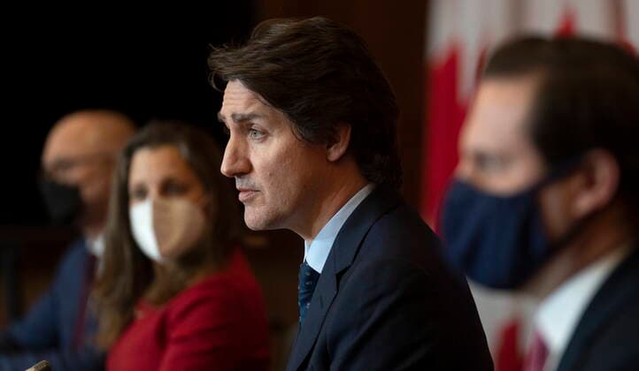 February 23, 2022, Ottawa, ON, Canada: Justice Minister and Attorney General of Canada David Lametti, Deputy Prime Minister and Finance Minister Chrystia Freeland and Public Safety Minister Marco Mendicino looks on as Prime Minister Justin Trudeau responds to a news conference, Wednesday, February 23, 2022 in Ottawa. Ottawa Canada  - ZUMAc35_ 20220223_zaf_c35_051 Copyright: xAdrianxWyldx