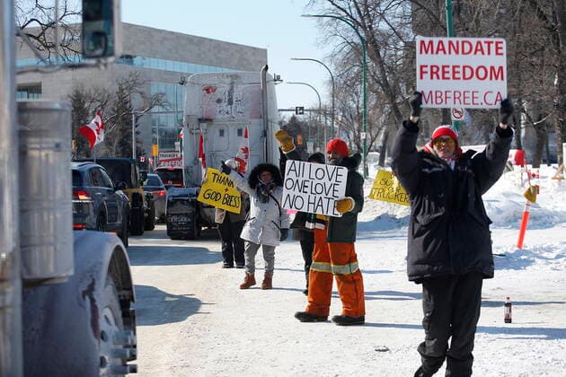 February 23, 2022, WINNIPEG, MANITOBA, CANADA: A small group of COVID-19 mandate protesters remain on the street as a convoy forms and heads home, Wednesday, February 23, 2022. The group received a notice from the Winnipeg Police that they have a deadline of 5pm Wednesday to move off the street and unblock Memorial Blvd. The group plans to depart peacefully and set up a camp in a nearby park. WINNIPEG CANADA  - ZUMAc35_ 20220223_zaf_c35_068 Copyright: xJohnxWoodsx