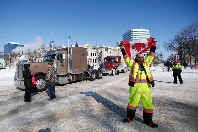 February 23, 2022, WINNIPEG, MANITOBA, CANADA: A small group of COVID-19 mandate protesters remain on the street as the group packs up and leaves, Wednesday, February 23, 2022. The group received a notice from the Winnipeg Police that they have a deadline of 5pm Wednesday to move off the street and unblock Memorial Blvd. The group plans to depart peacefully and set up a camp in a nearby park. WINNIPEG CANADA  - ZUMAc35_ 20220223_zaf_c35_074 Copyright: xJohnxWoodsx